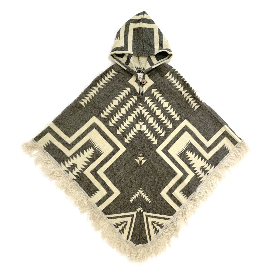 Adult poncho front with hood and fringe with a gray/brown color backgrpound and a cream color pattern with arrows and square shapes
