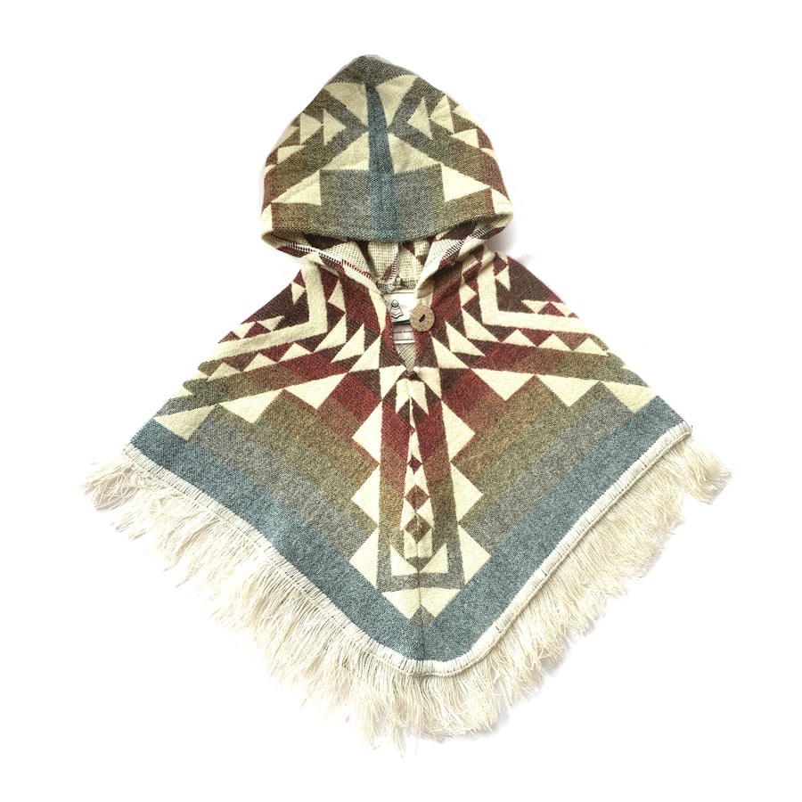 front of baby and toddler poncho with hood and fringe in the bottom, with colors red, orange, yellow, blue with white patterns on top