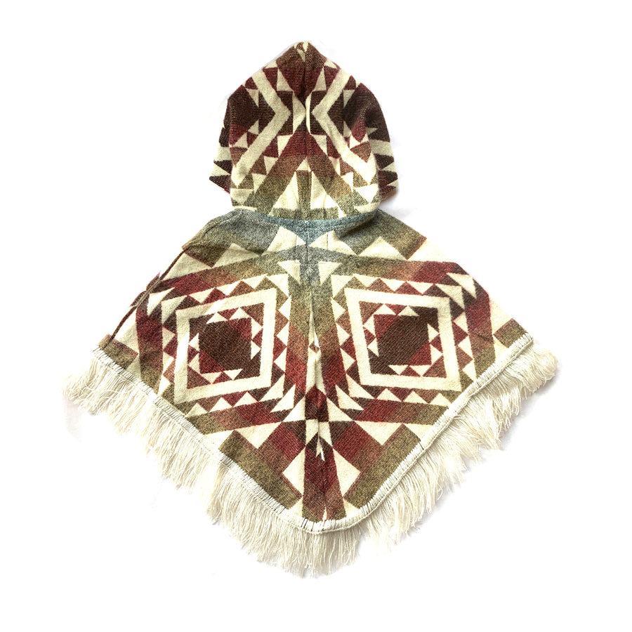  back of baby and toddler poncho with hood and fringe in the bottom, with colors red, orange, yellow, blue with white patterns on top