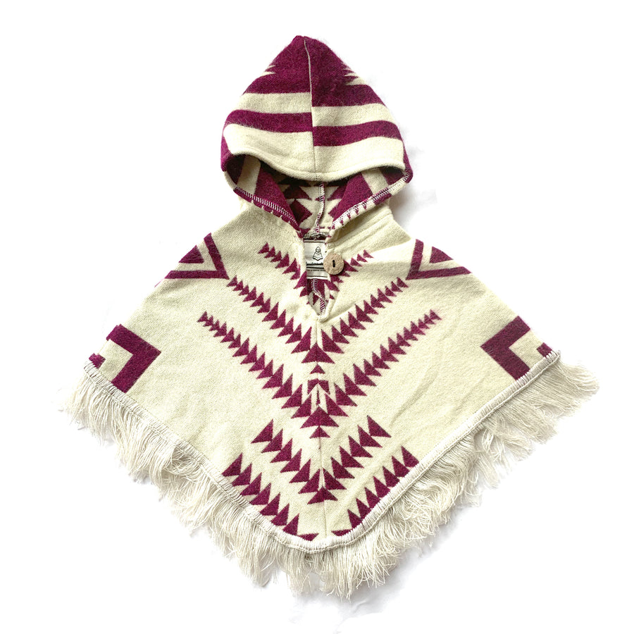 front of baby and toddler poncho with a hood and fringe in the bottom with a background color of white and plum color  arrows