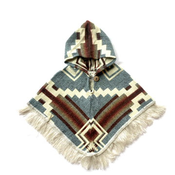 front of baby and toddler poncho with hood and fringe with color light blue and brown and orange with some white patterns on top