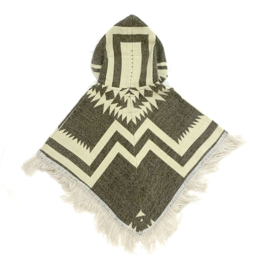 back of baby and toddler poncho with a hood and fringe in the bottom with a base color of a gray brown and cream color shapes and lines on top