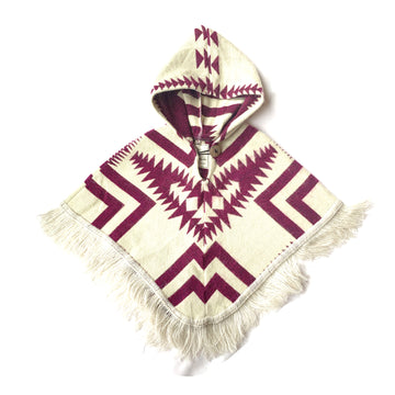 front of baby and toddler poncho with hood and fringe in the bottom in white and with a plum color pattern on top