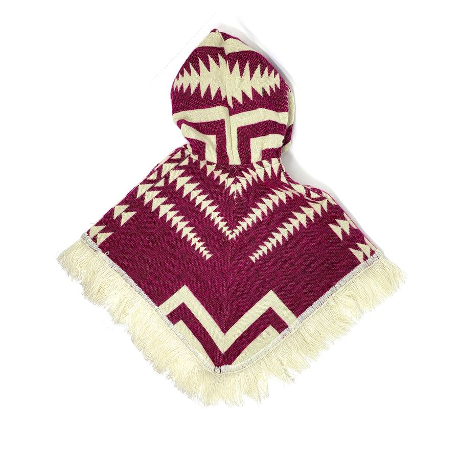 back of poncho that is two colors, plum and white. the pattern is mostly triangle shapes that form arrows. the hood has white lines and arrow  patterns