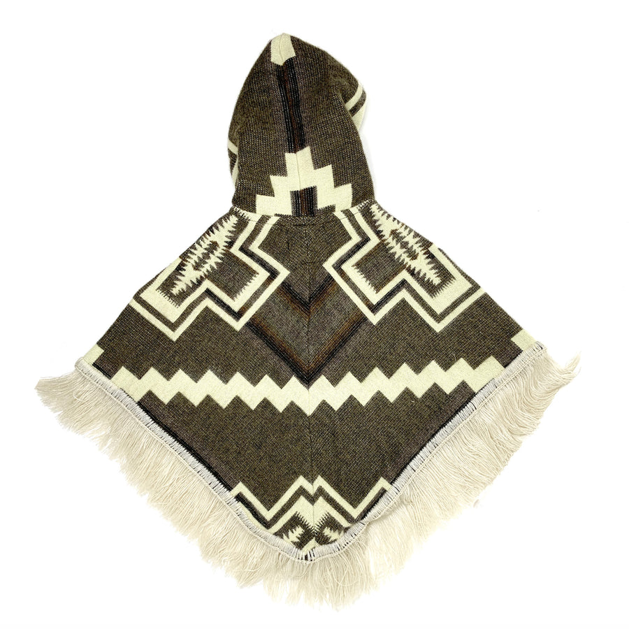 back of baby poncho with hood in brown with white designs of crosses in each sude and a white zigzag line in the middle
