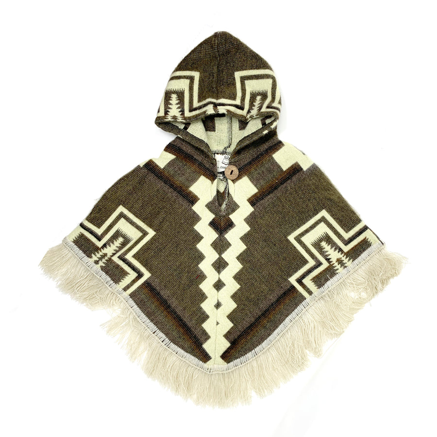 front of baby poncho with a hood in brown with white cross designs on the sides and two parallel white lines in the middle (vertical)