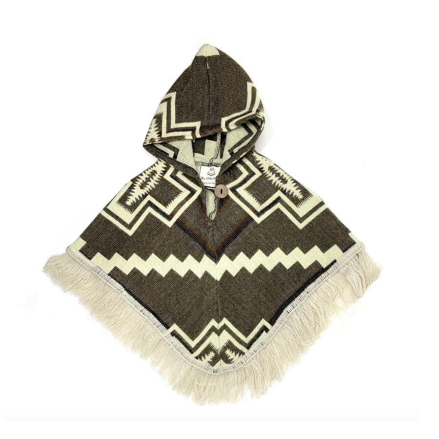 front of baby poncho with hood in brown with white designs of crosses in each sude and a white zigzag line in the middle